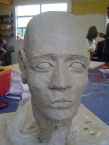 Putting on the facial features, stage 3, front view