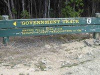 DOC sign pointing back down the track.