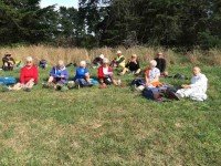 Hikers at lunch part way up hill.