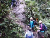 G.2nd-- Waiting @ climbing the cliff face with the aid of a ropec